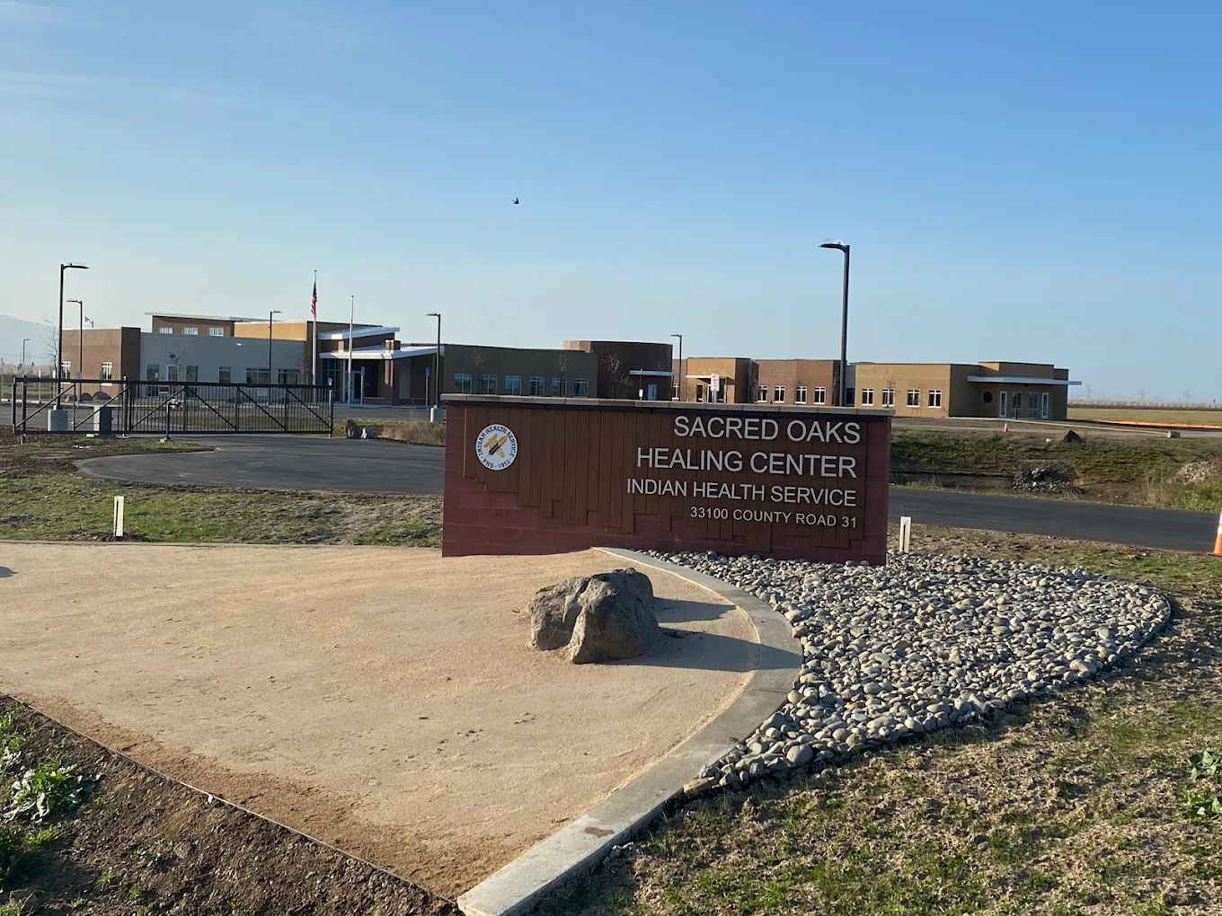Sacred Oaks Healing Center sign and facility exterior