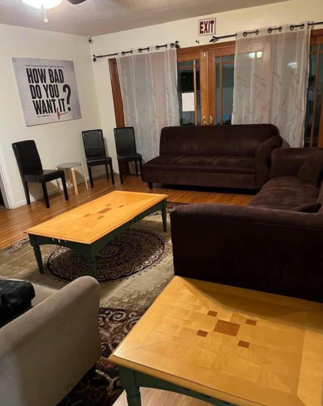 Lounge with sofas, coffee tables, and motivational sign
