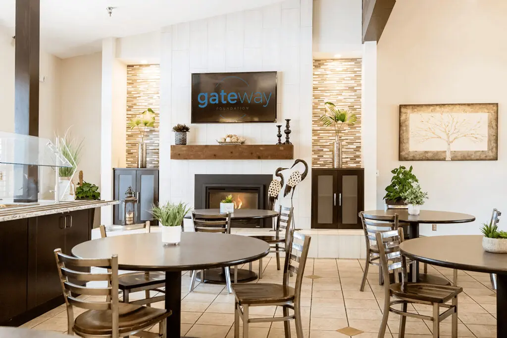 Dining space with round tables and wall-mounted TV