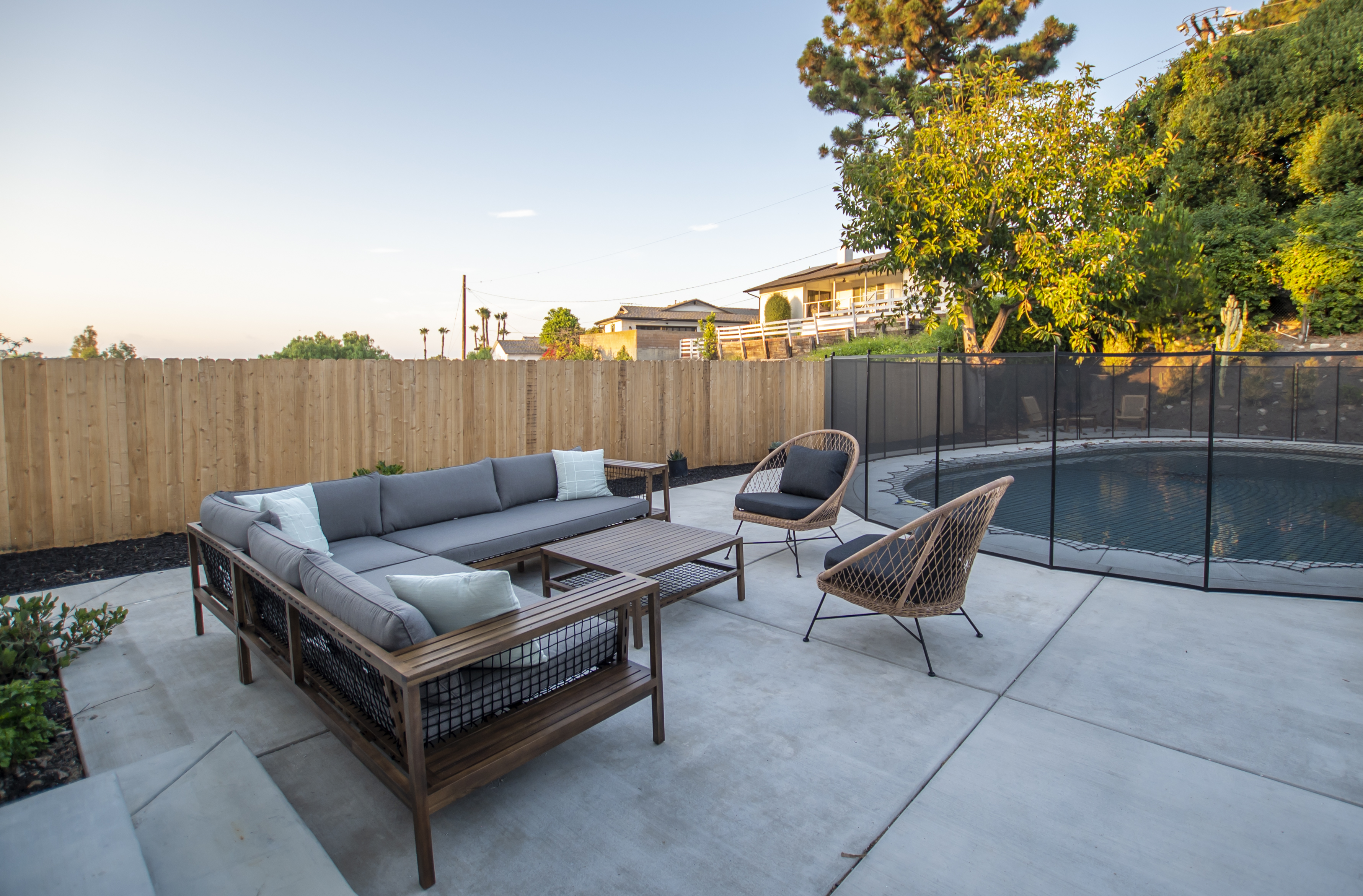 Poolside seating area with modern outdoor furniture