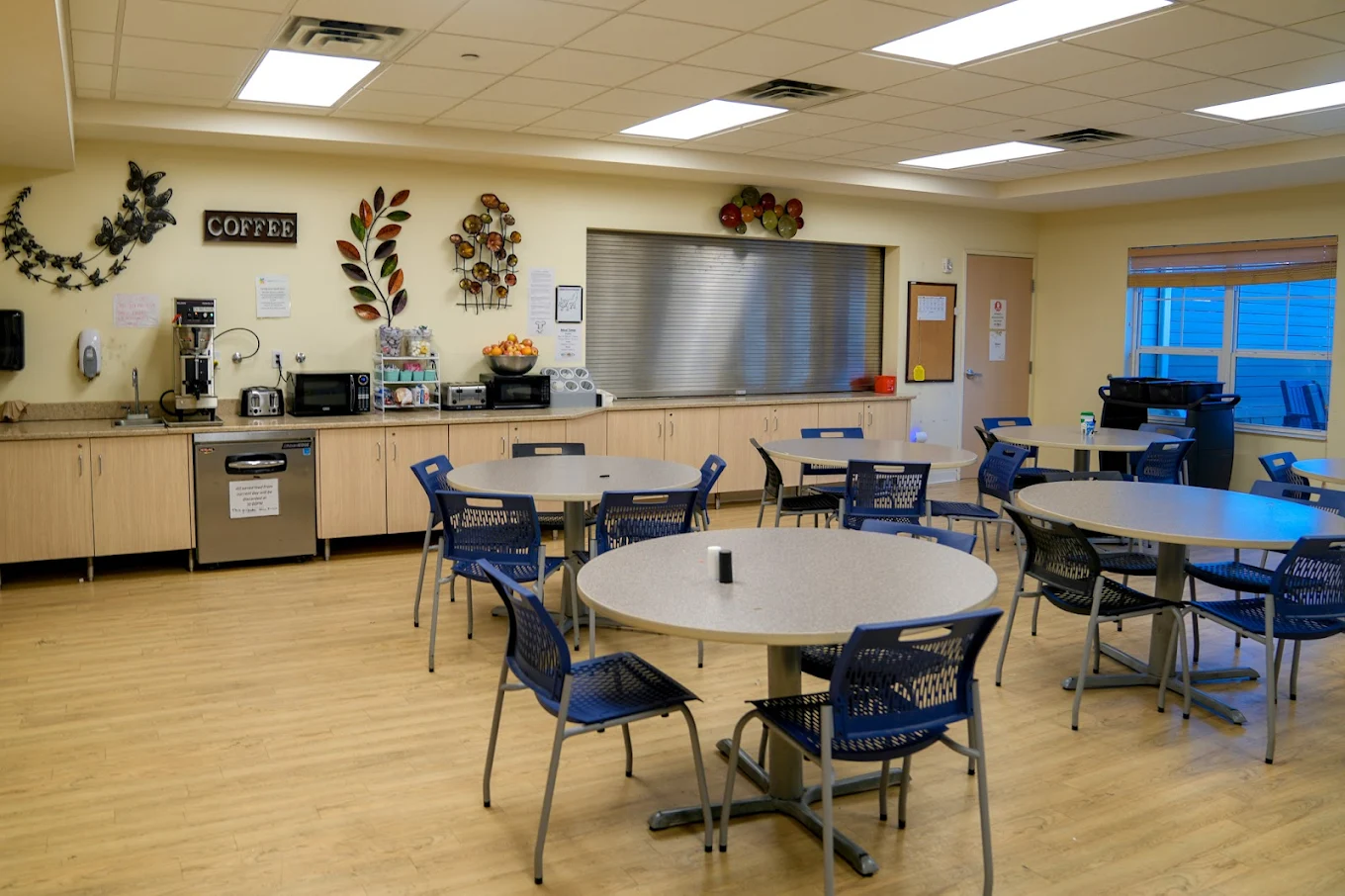 Dining room with round tables and coffee station