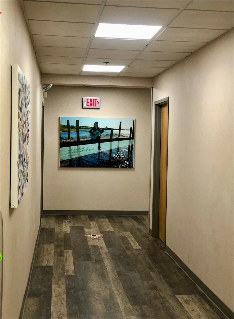 Interior hallway with offices and wall artwork