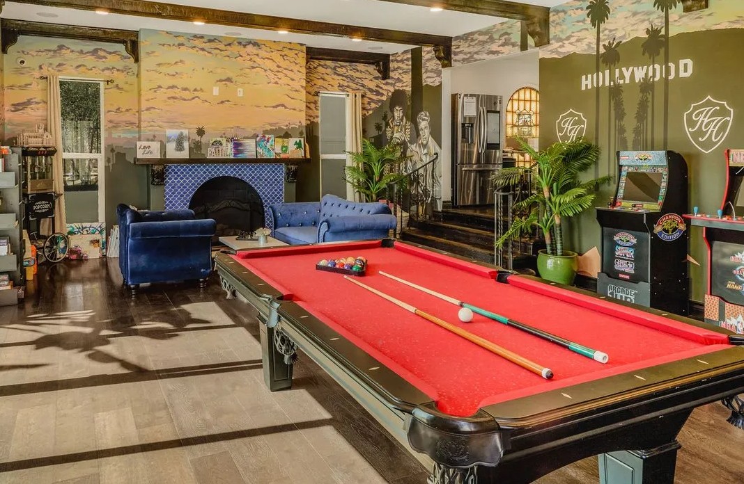 Recreation room with pool table, arcade games, and lounge seating