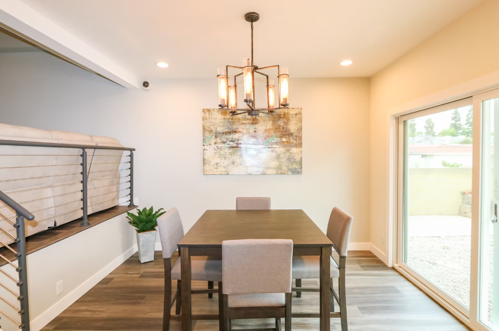 Dining room with six chairs and modern chandelier
