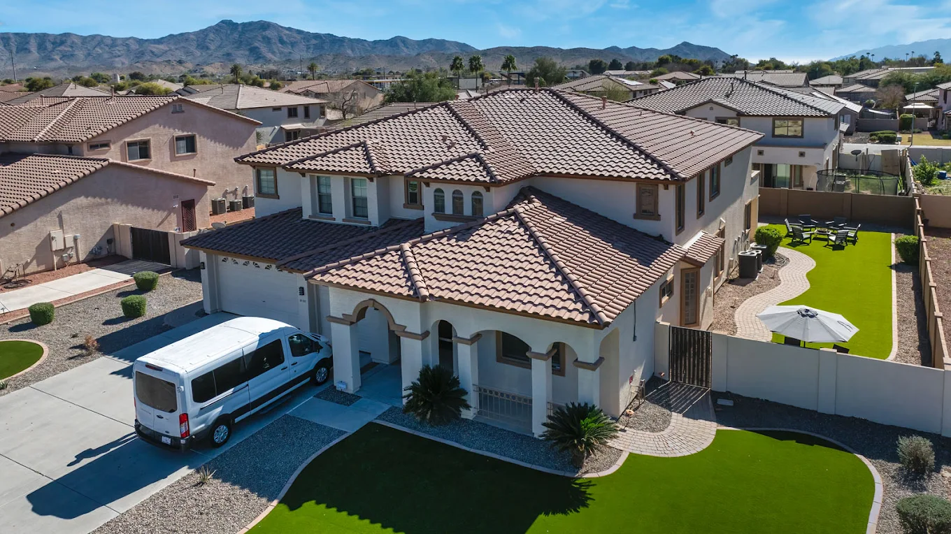 Residential home with yard and mountain view in background