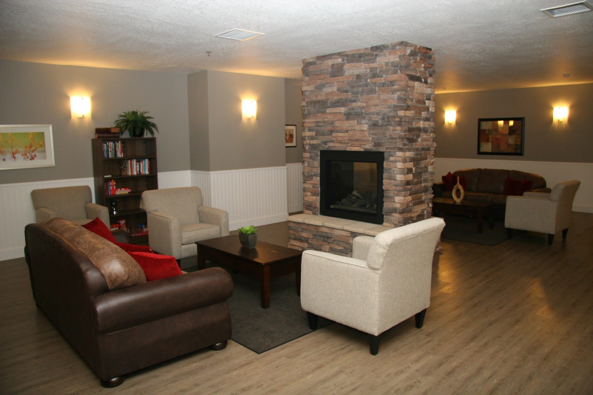 Cozy lounge with fireplace and armchairs