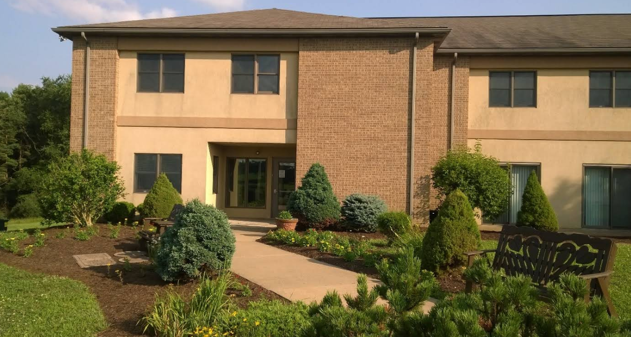 Front exterior of SpiritLife residential treatment building with landscaping