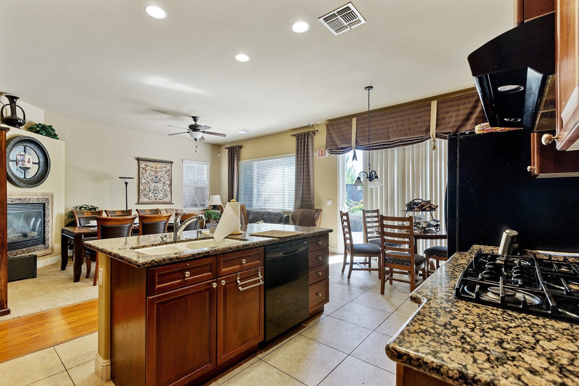 Open-plan kitchen with island, table, and living space