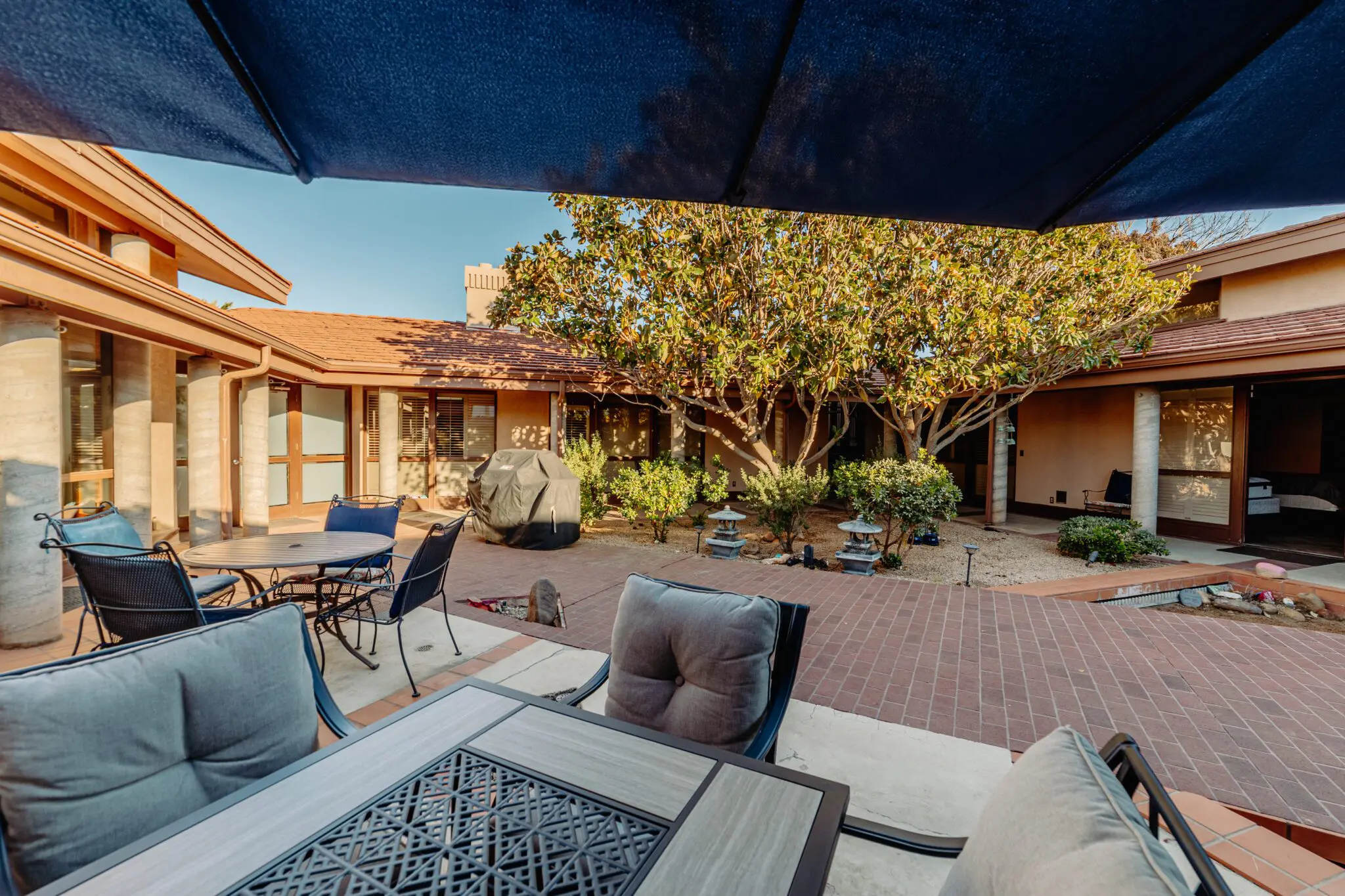 Outdoor courtyard with seating and shaded patio areas