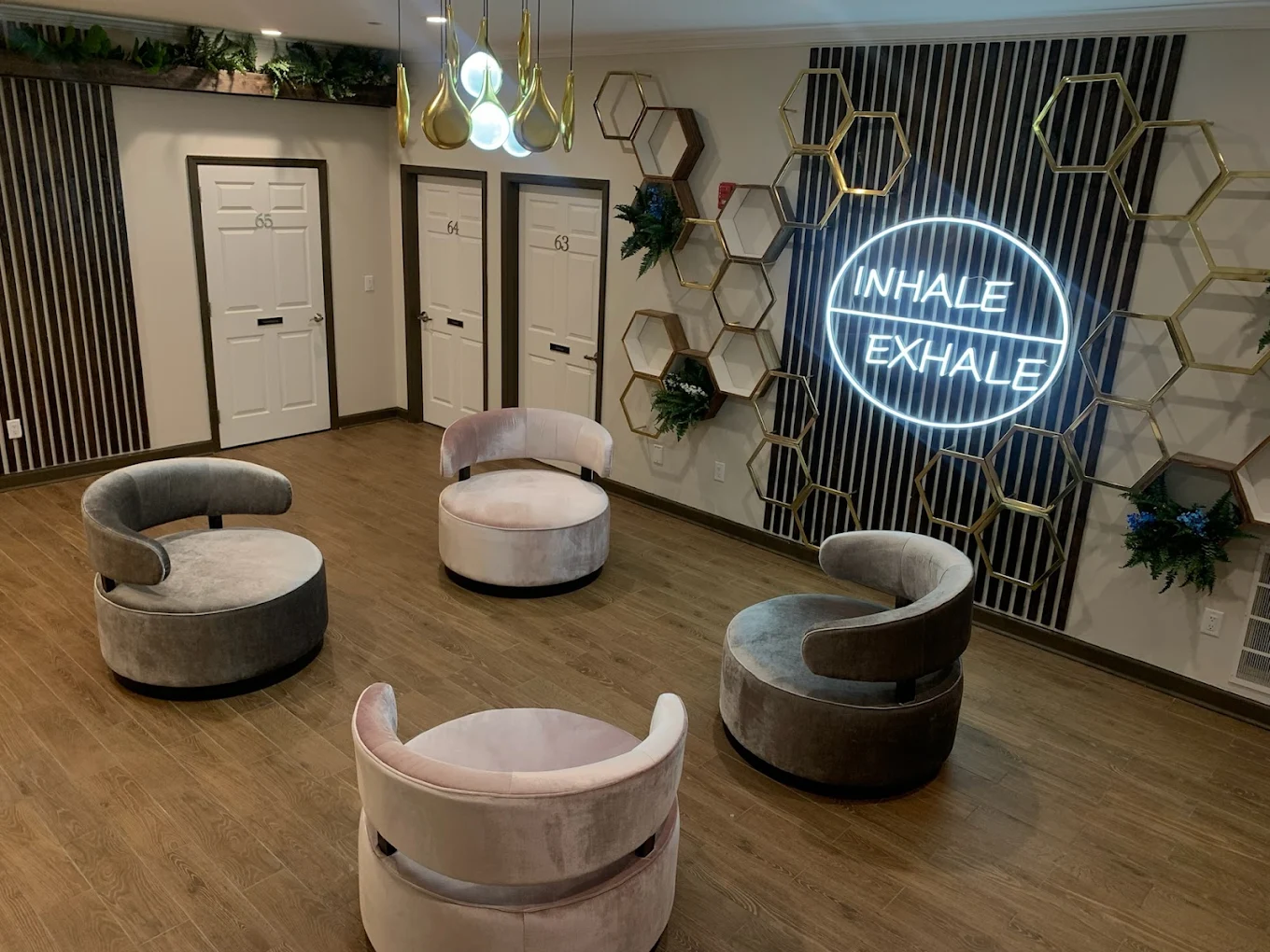Cozy room with modern chairs and “Inhale Exhale” sign