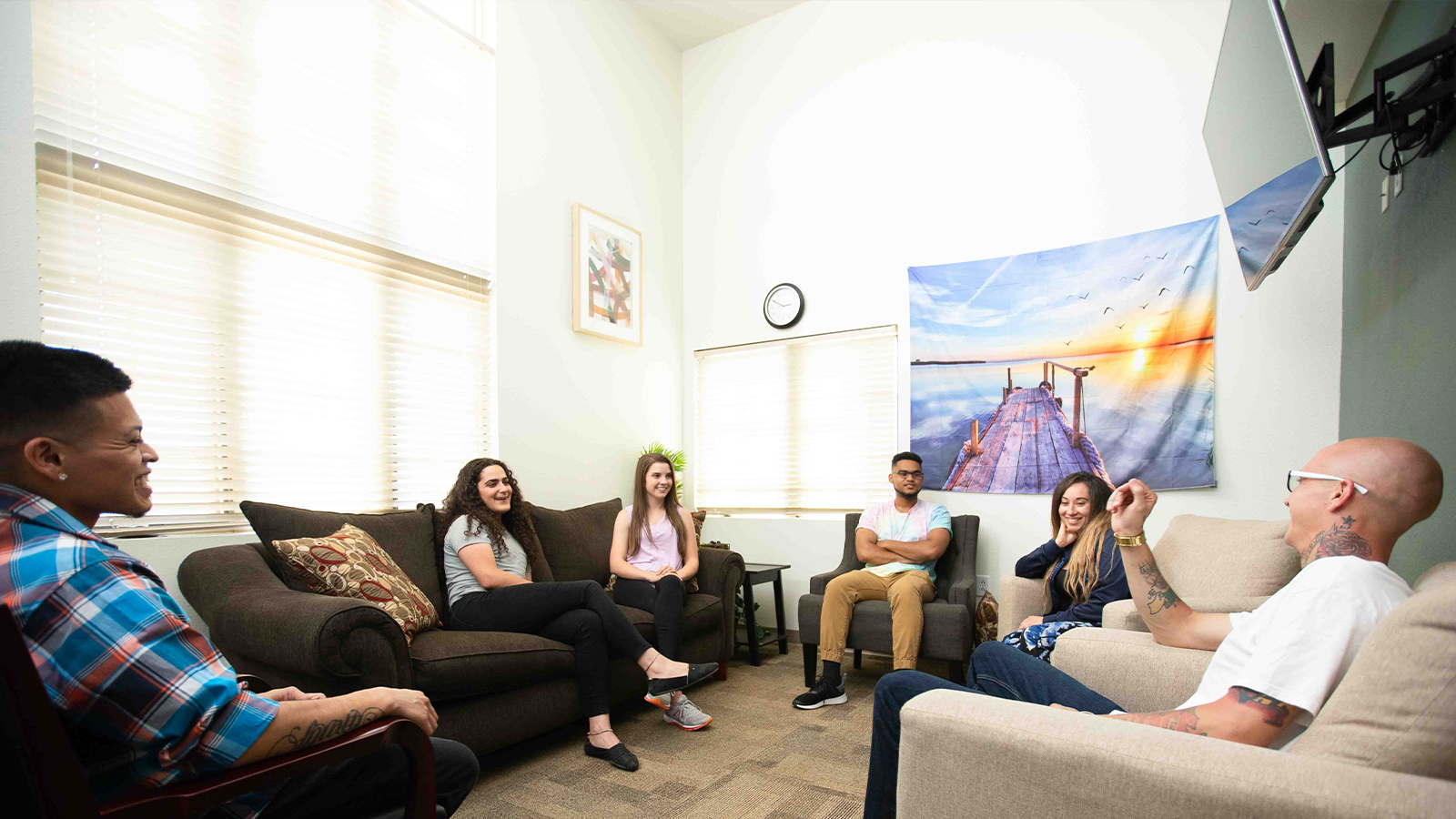 Small group counseling session with sofas.