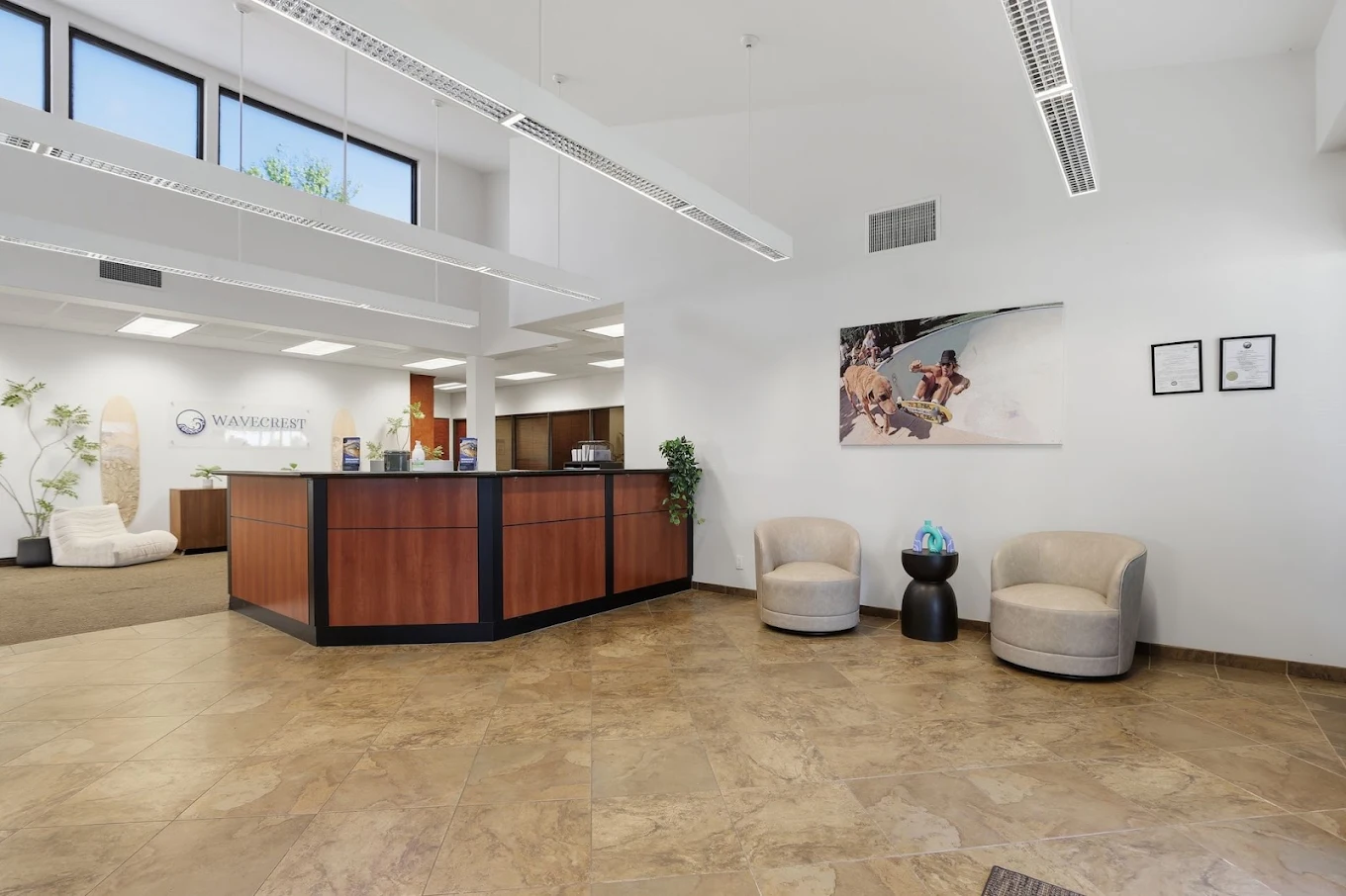 Reception desk and seating in the bright facility lobby
