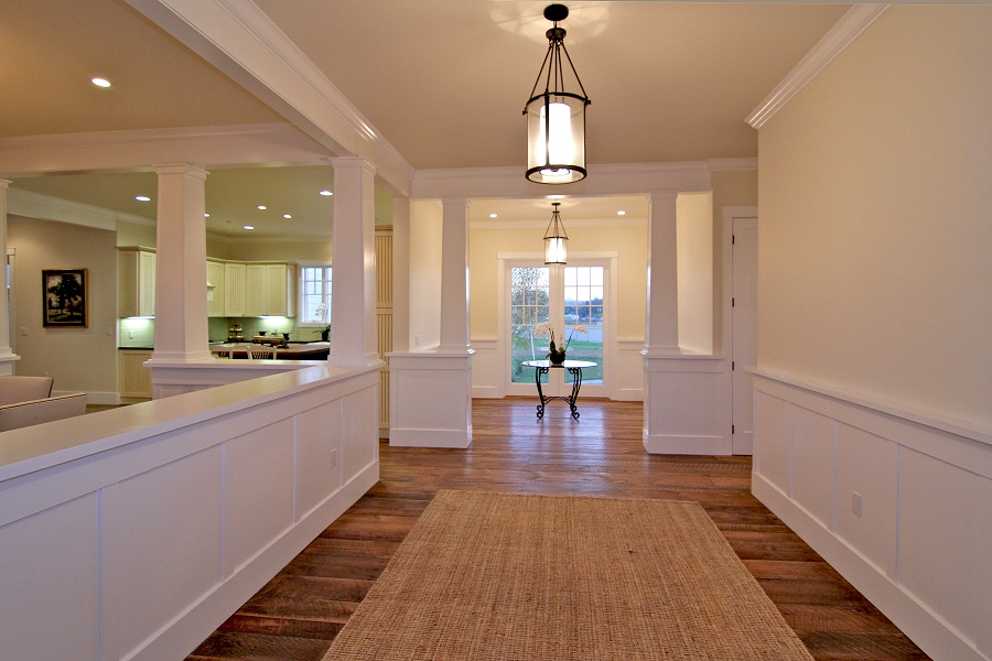 Hallway with kitchen in view.