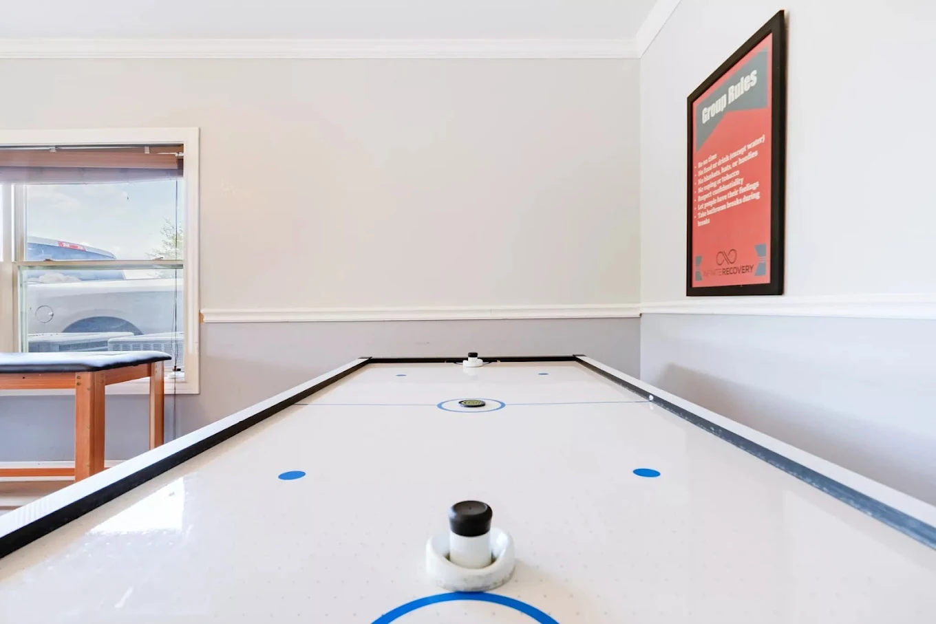 Air hockey table in recreation room for resident activities