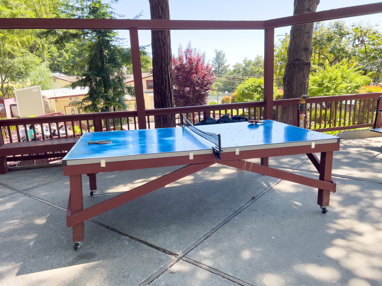 Outdoor ping pong table on shaded patio
