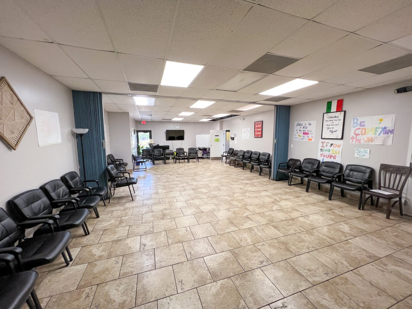 Spacious group meeting room with chairs arranged for recovery meetings
