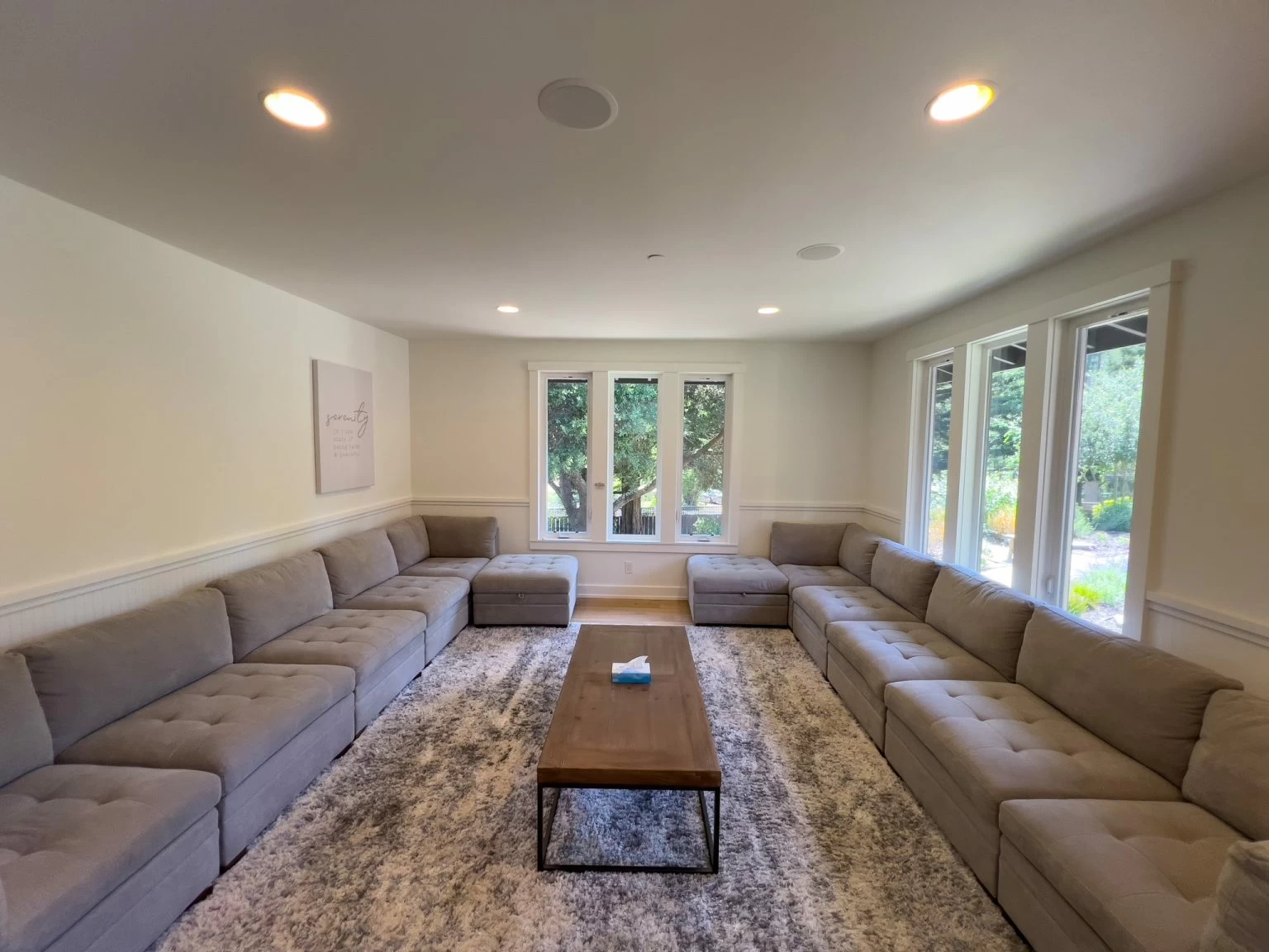 Group therapy room with sofas and open seating layout