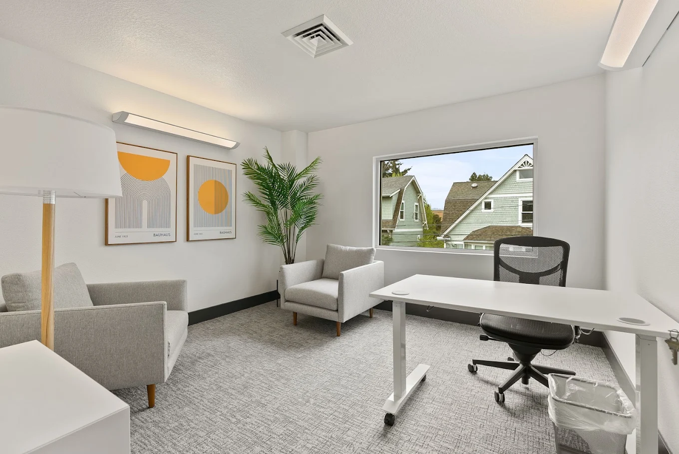 Private therapy office with desk and comfortable seating