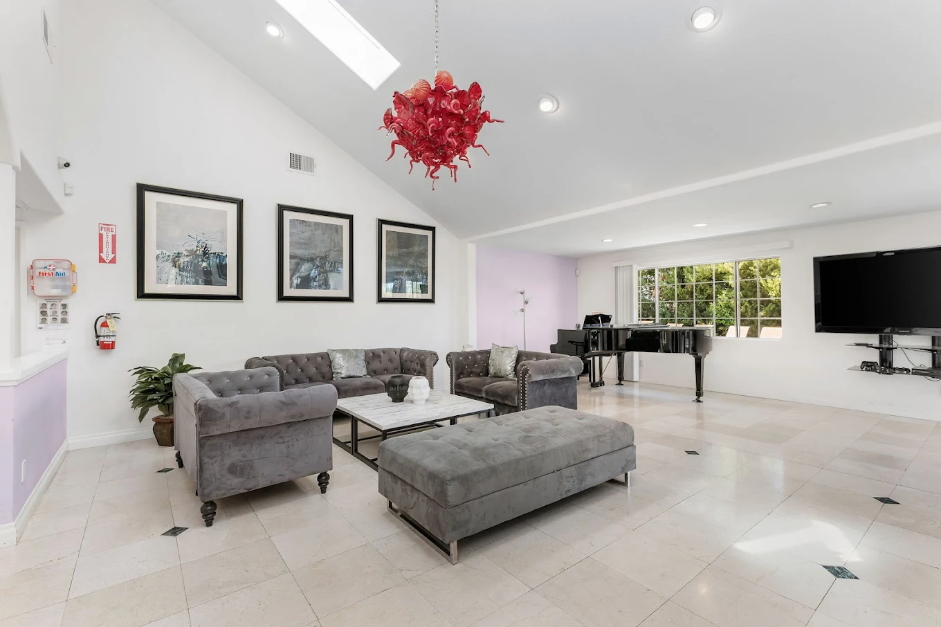 Entertainment lounge with seating and piano at West Valley Detox