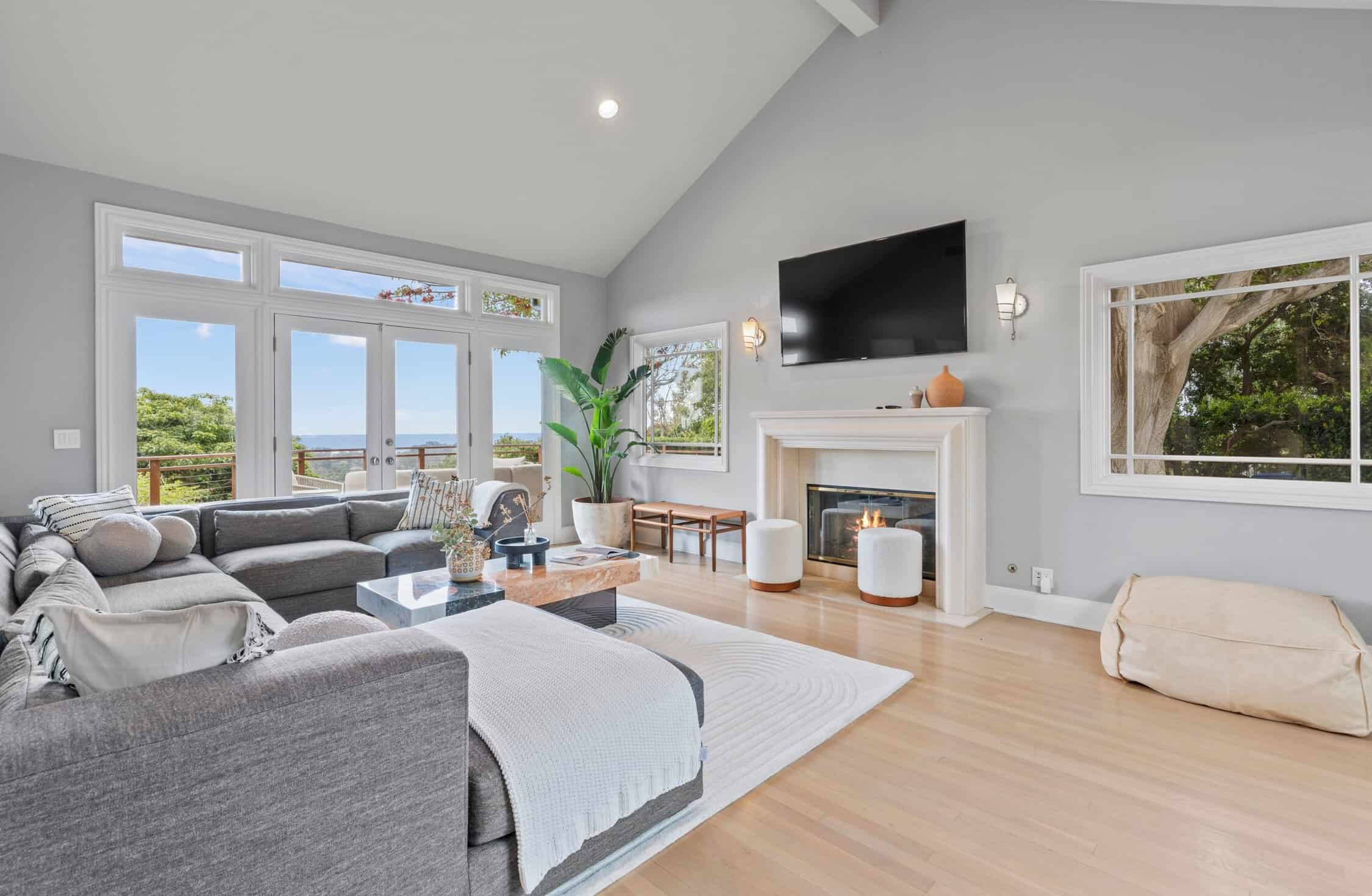 Spacious living room with fireplace and ocean views
