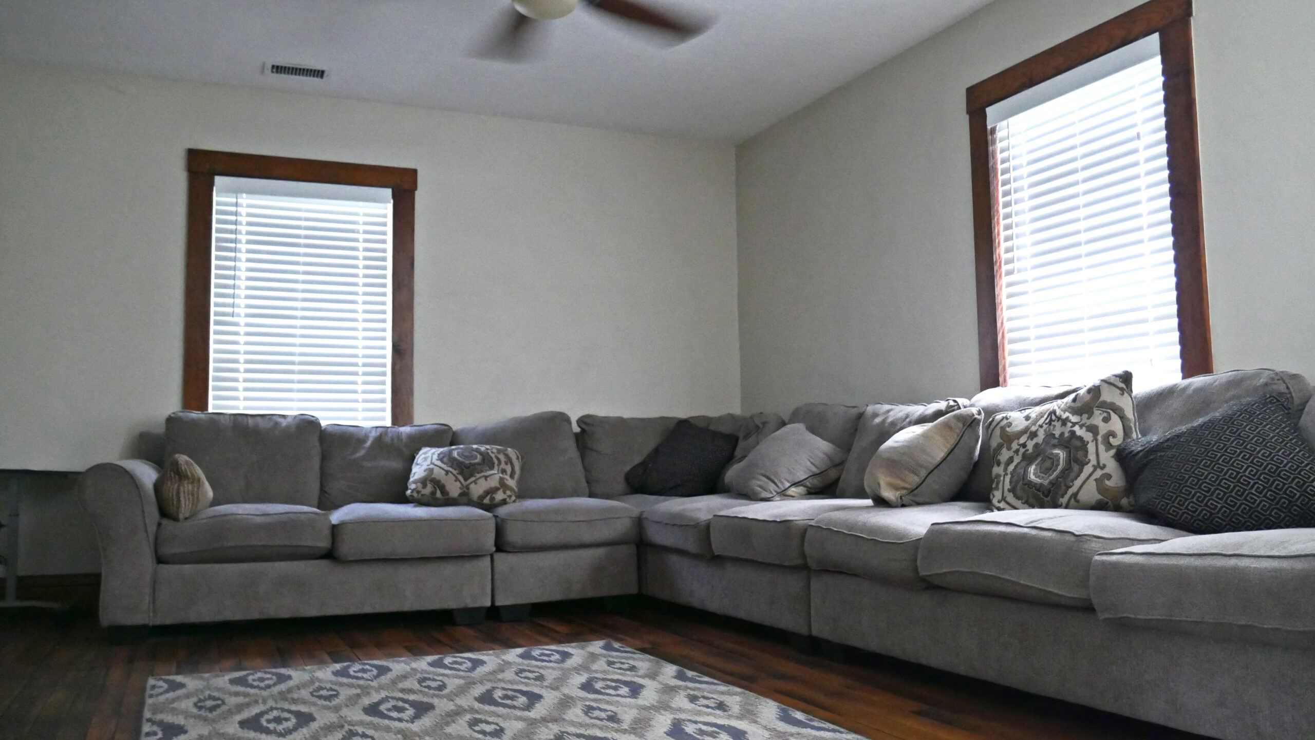 Comfortable lounge with sectional sofa and natural light