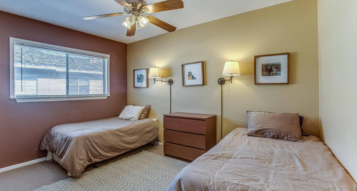Bedroom with twin beds and warm wall colors