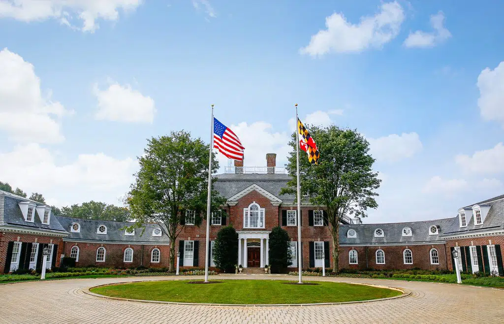 Brick facility with flags and circular driveway