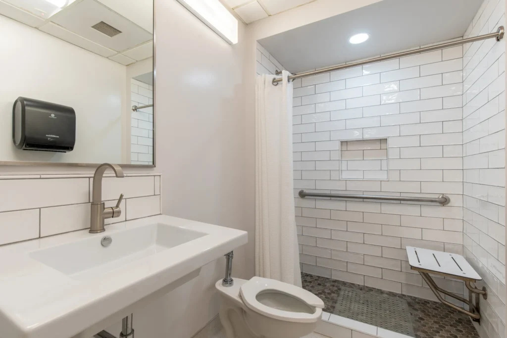 Modern bathroom with walk-in shower and white tile