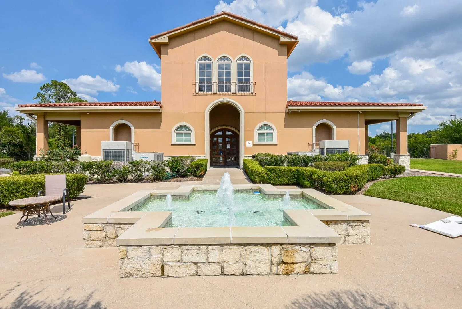 Exterior of a two-story rehab facility with a red tile roof.