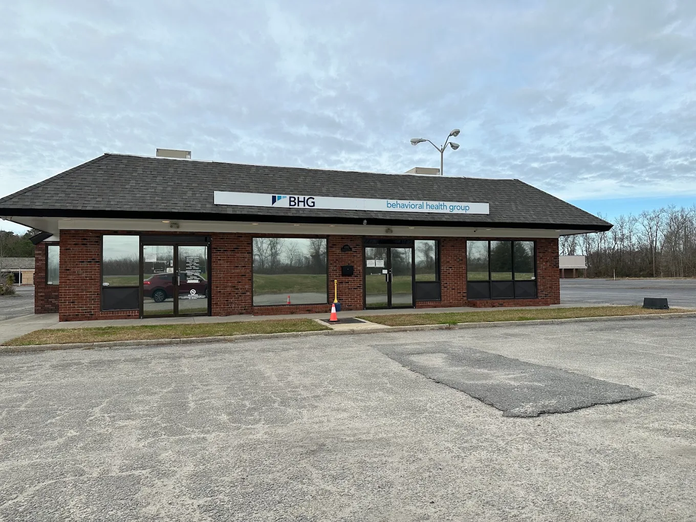 Front exterior of BHG Franklin Treatment Center with parking lot
