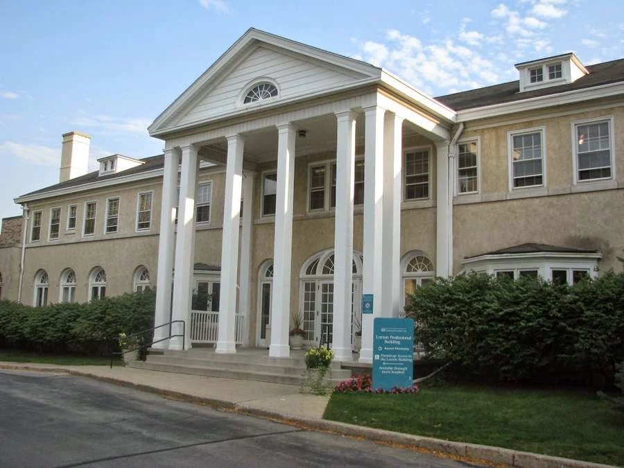 Large hospital building with white columns and windows