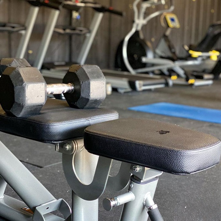 Dumbbell and equipment inside rehab facility gym