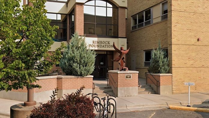 Rimrock Foundation main entrance with statue and greenery