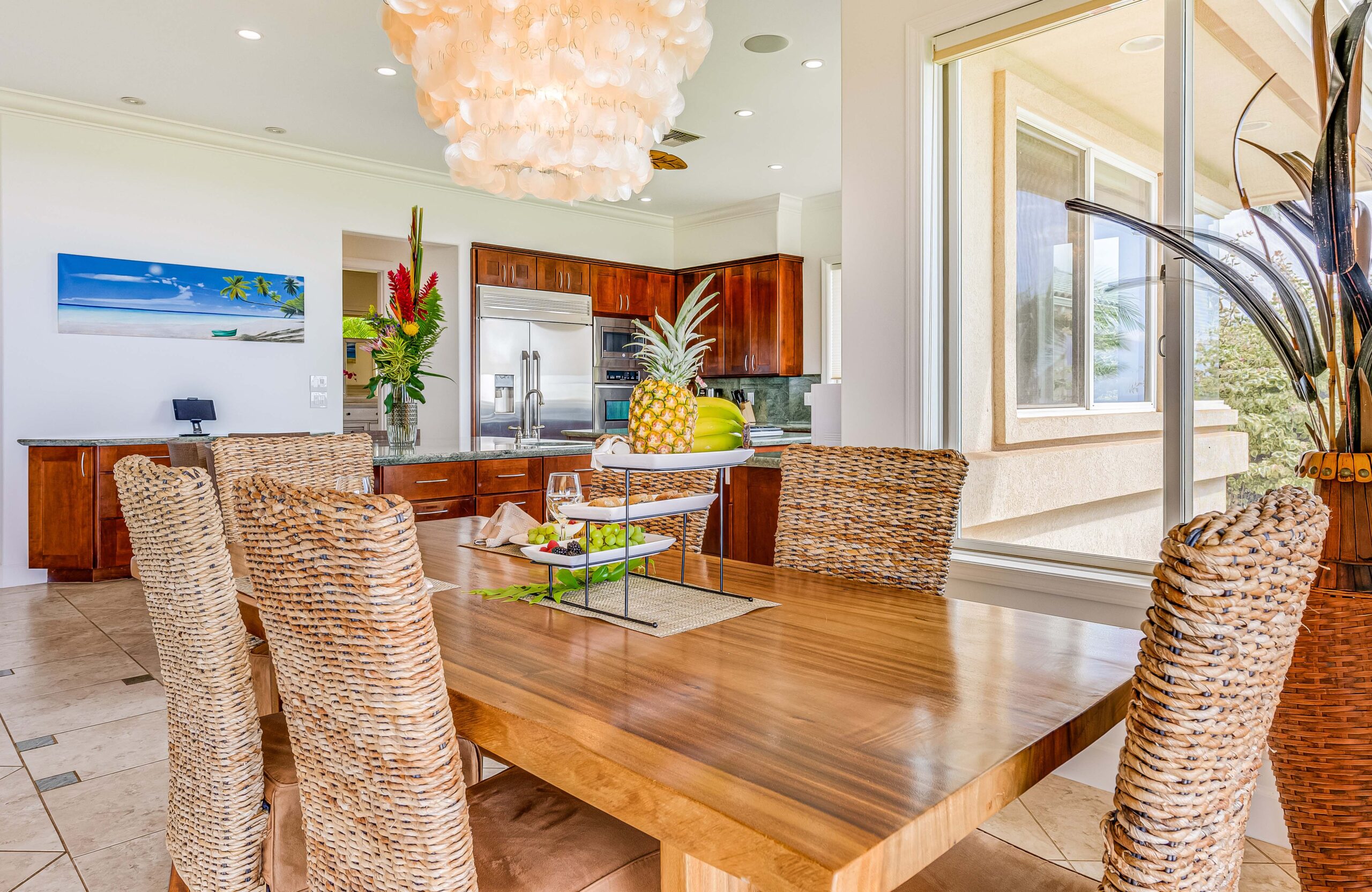 Elegant dining area with woven seating adjacent to the gourmet kitchen