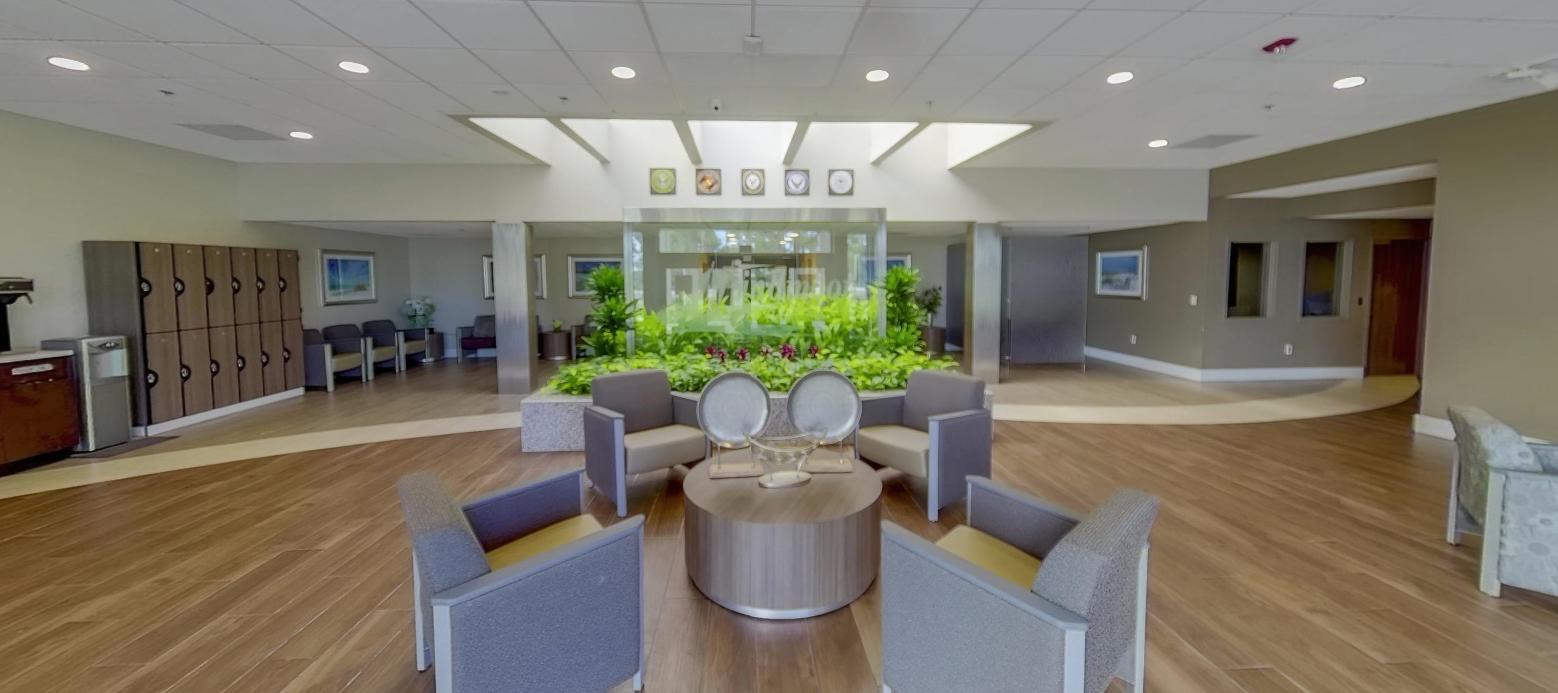 Spacious lobby atrium with seating and indoor garden
