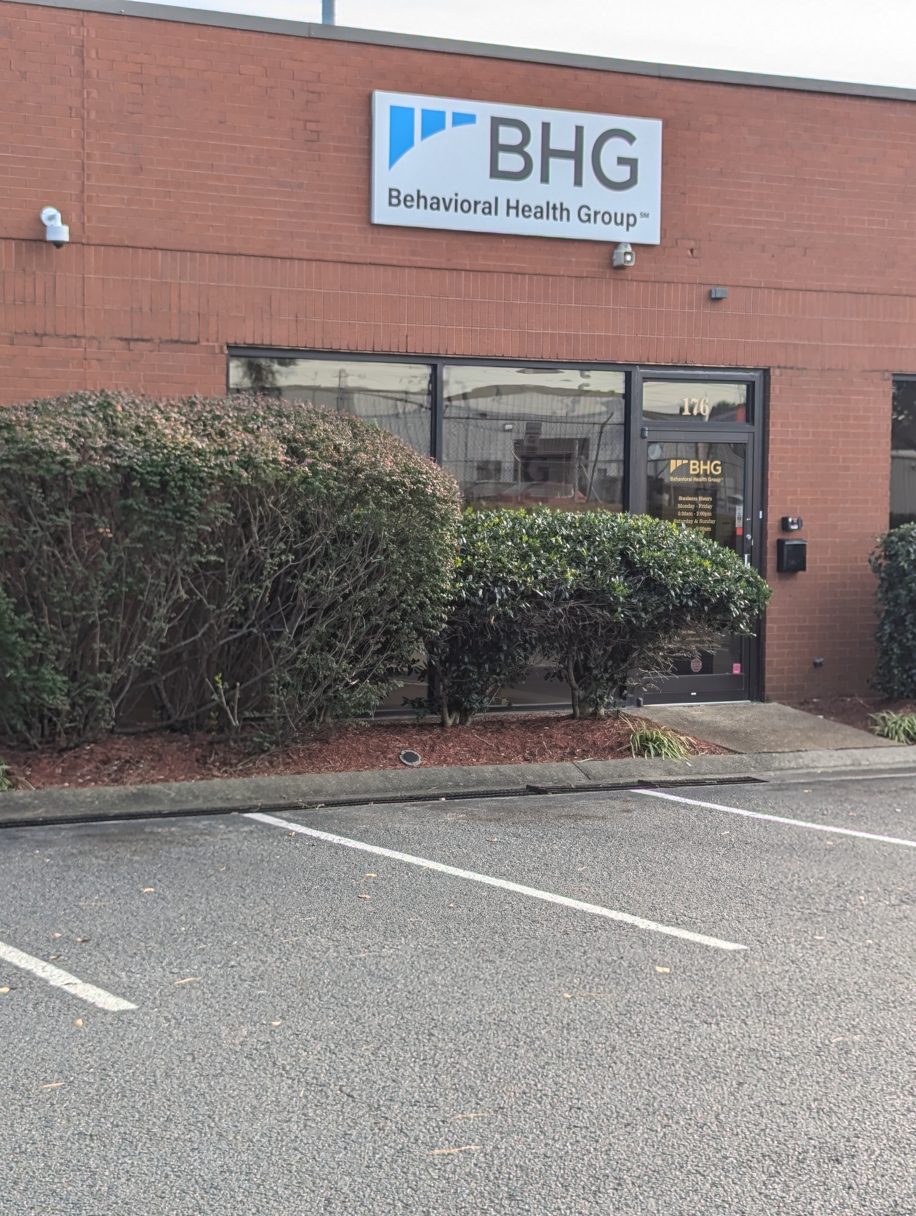 Front entrance with BHG signage and landscaped walkway