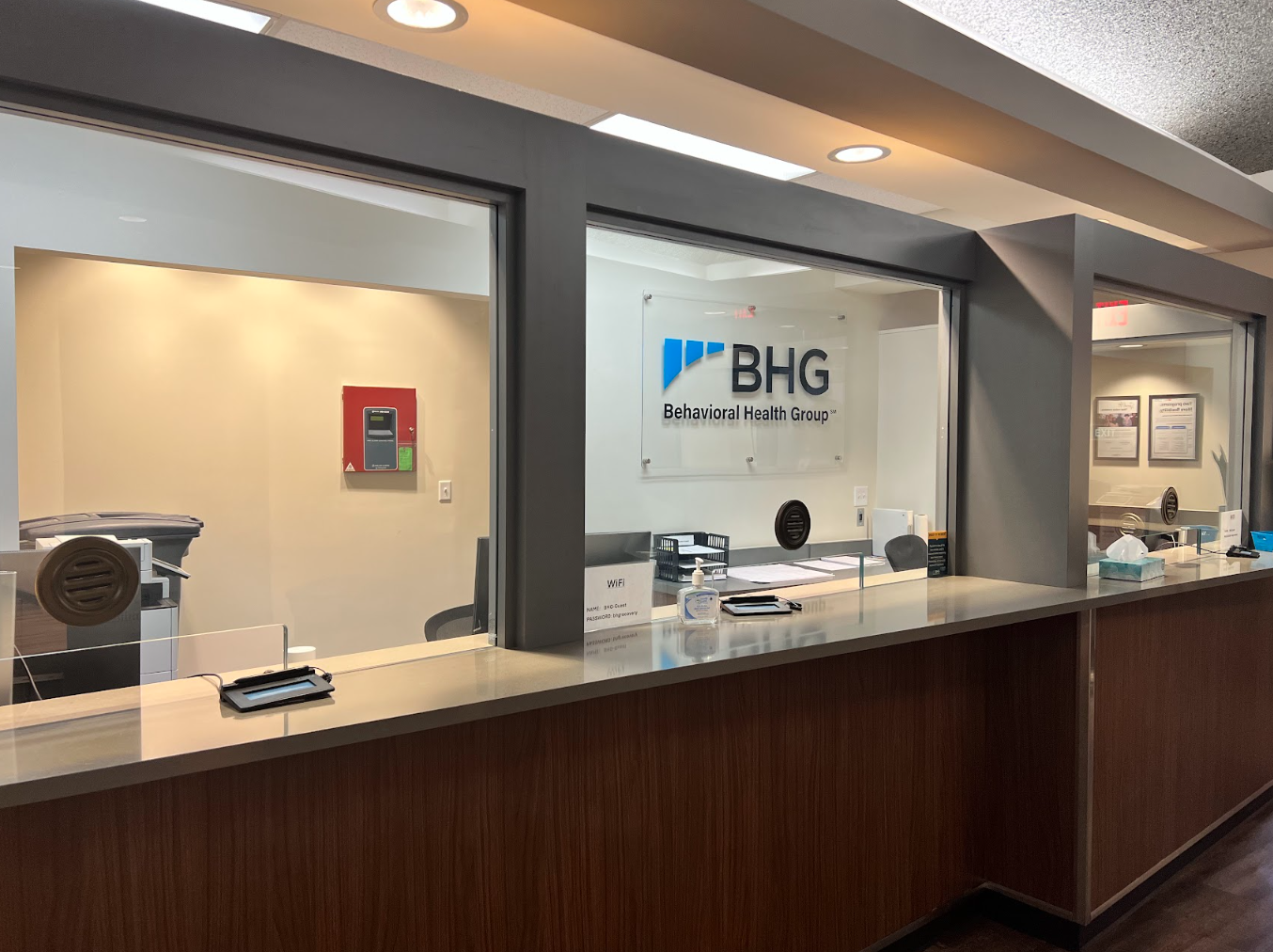 Reception desk with secure check-in windows and counter
