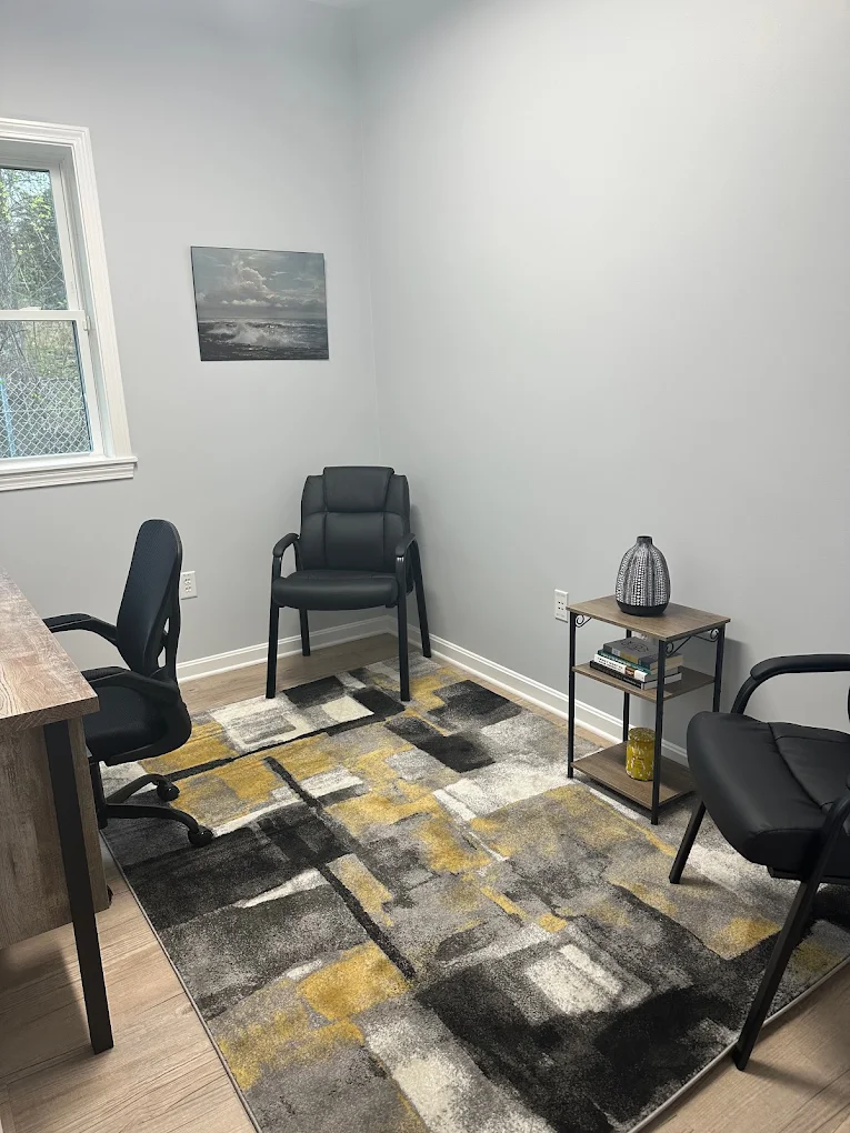 Private counseling room with chairs and modern rug