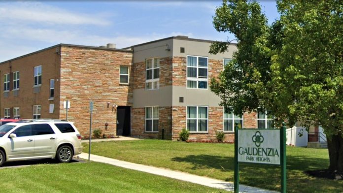 Two-story rehab facility with brick design and front lawn