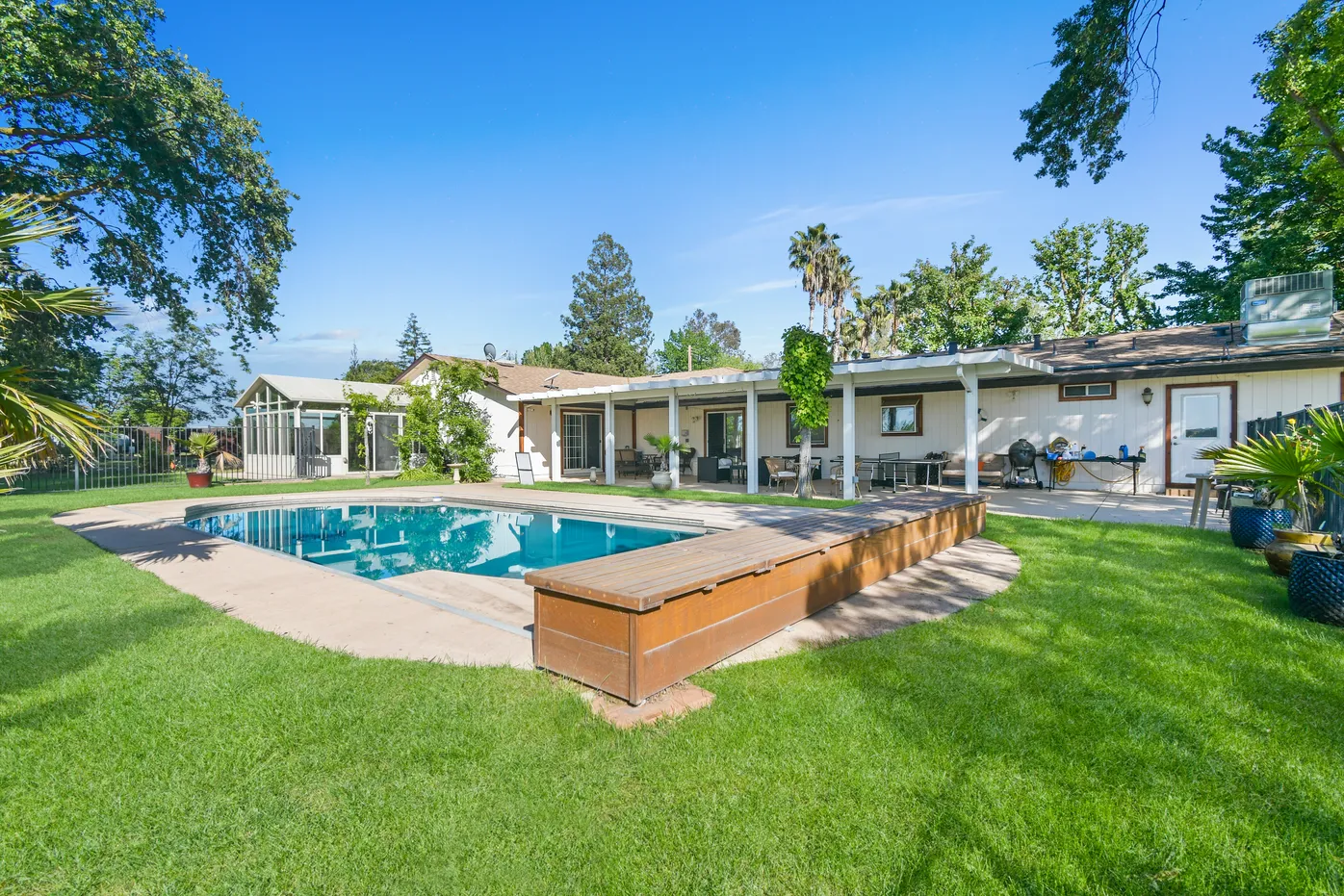 Outdoor pool behind one-story facility