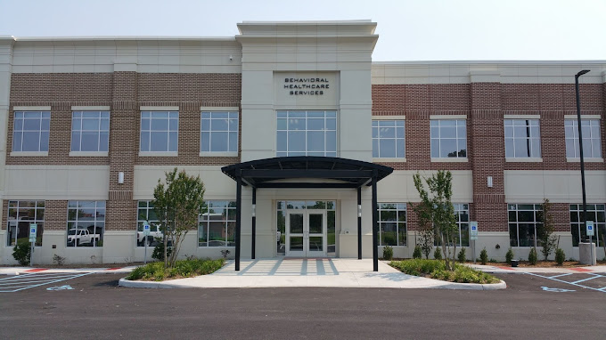 Front view of a well-maintained outpatient treatment center with a modern facade.