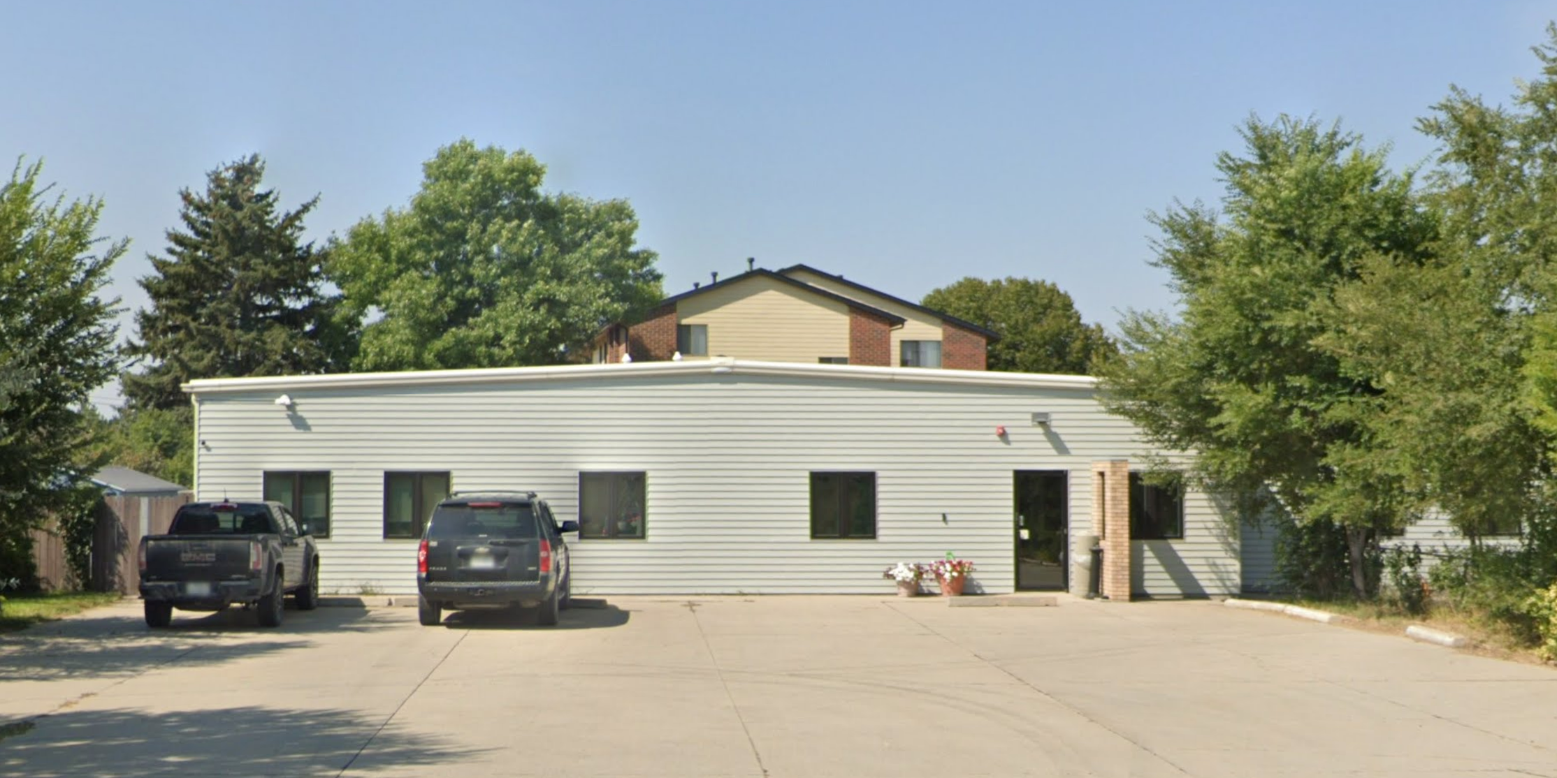 Front entrance with parking area at treatment facility.