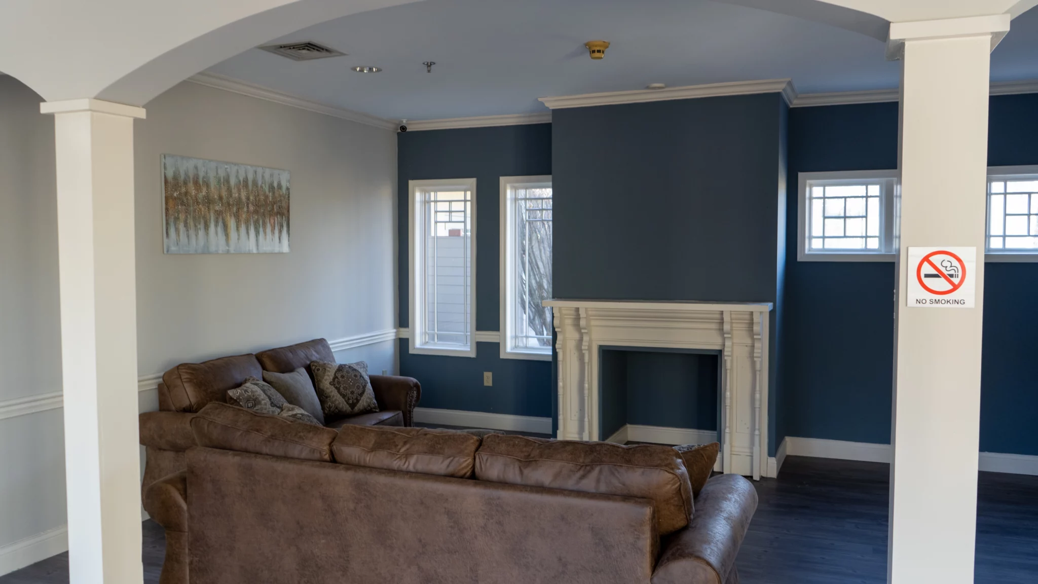 Living room with sofas and decorative fireplace