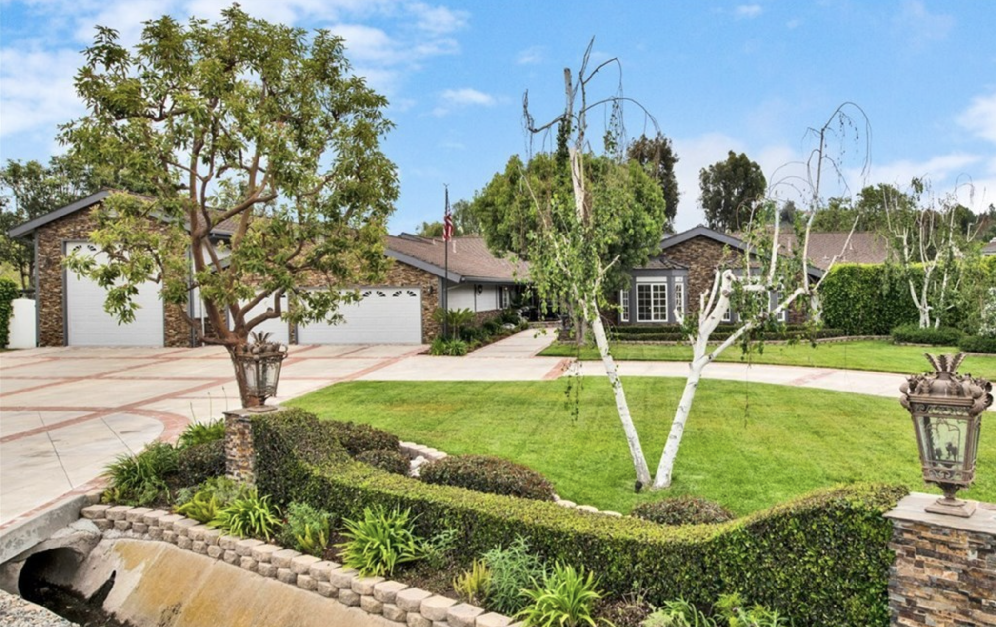 Facility front with entrance and lawn.