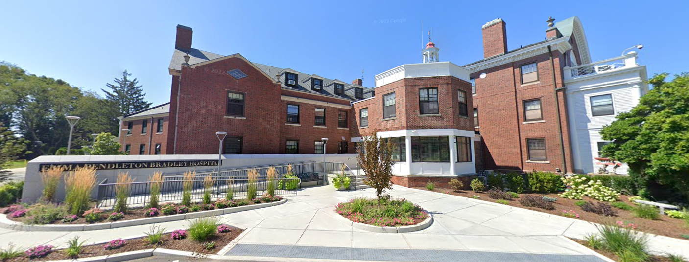 Brick exterior of Emma Pendleton Bradley Hospital with landscaped entrance