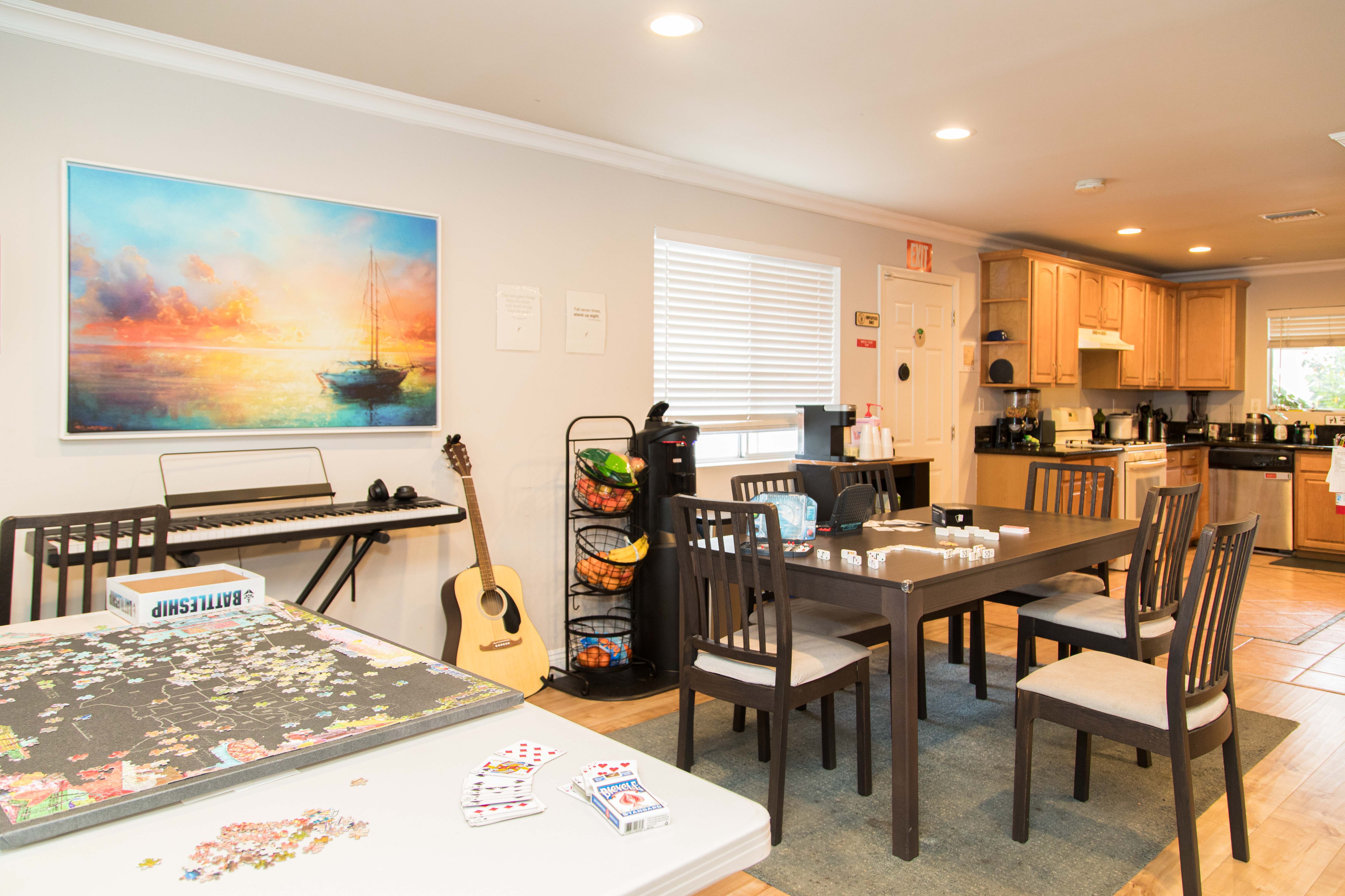 Kitchen and dining area with musical instruments.