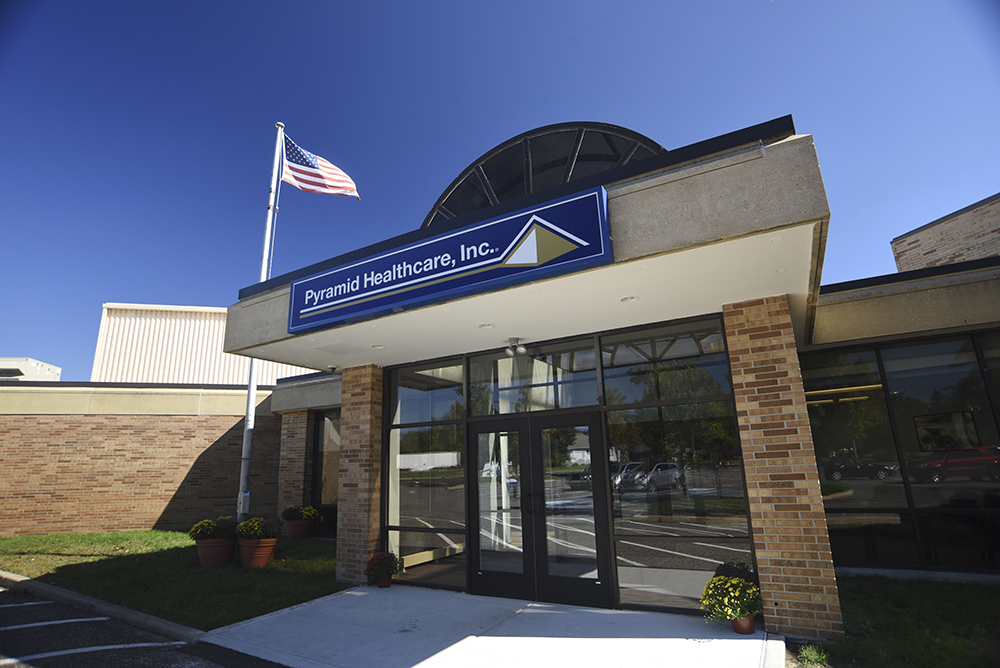 Glass entrance with Pyramid Healthcare sign