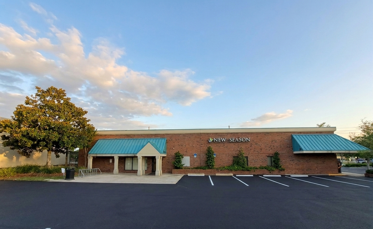 New Season brick facility with covered entry and parking lot