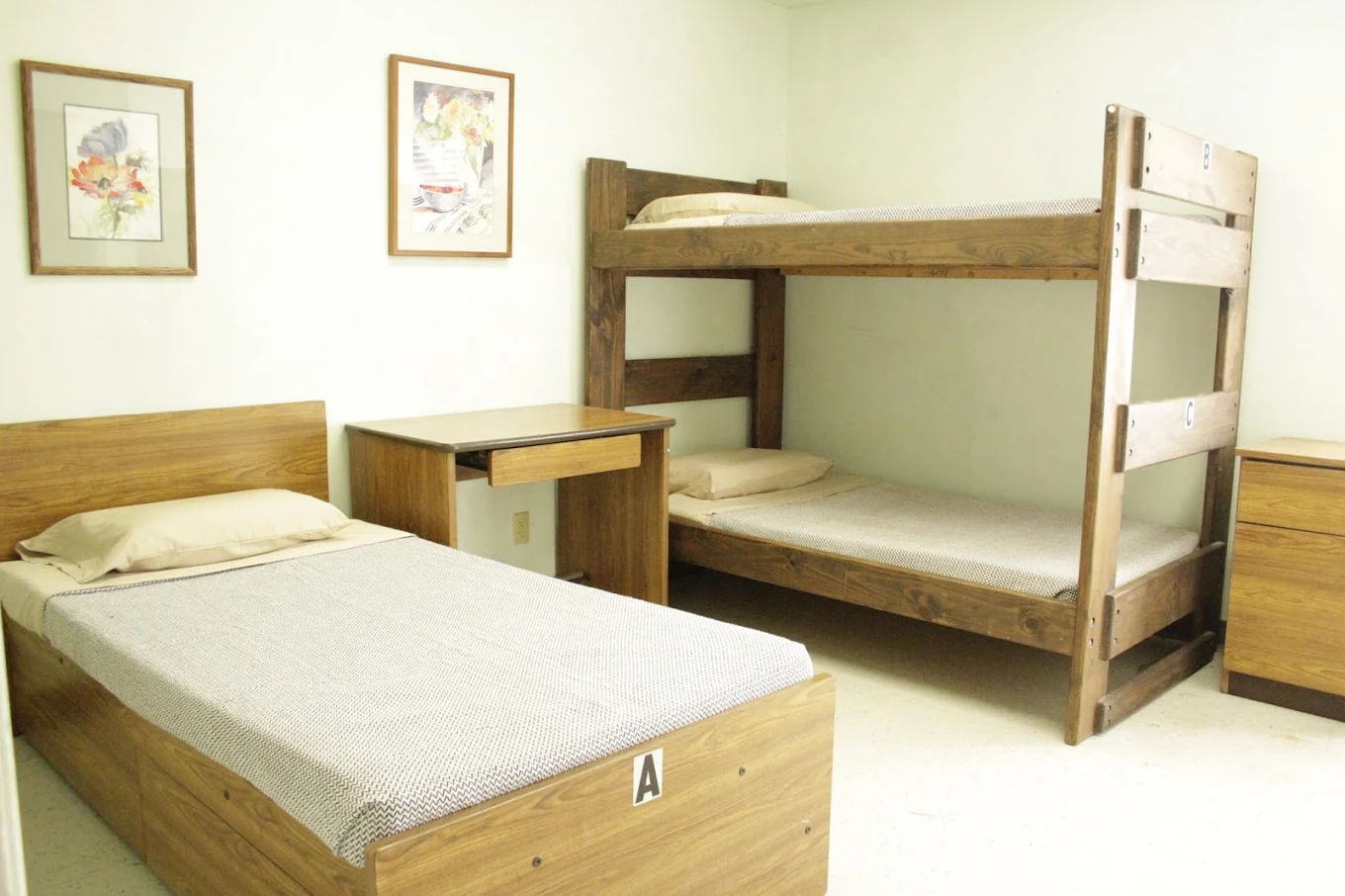 Shared room with bunk bed and single bed.