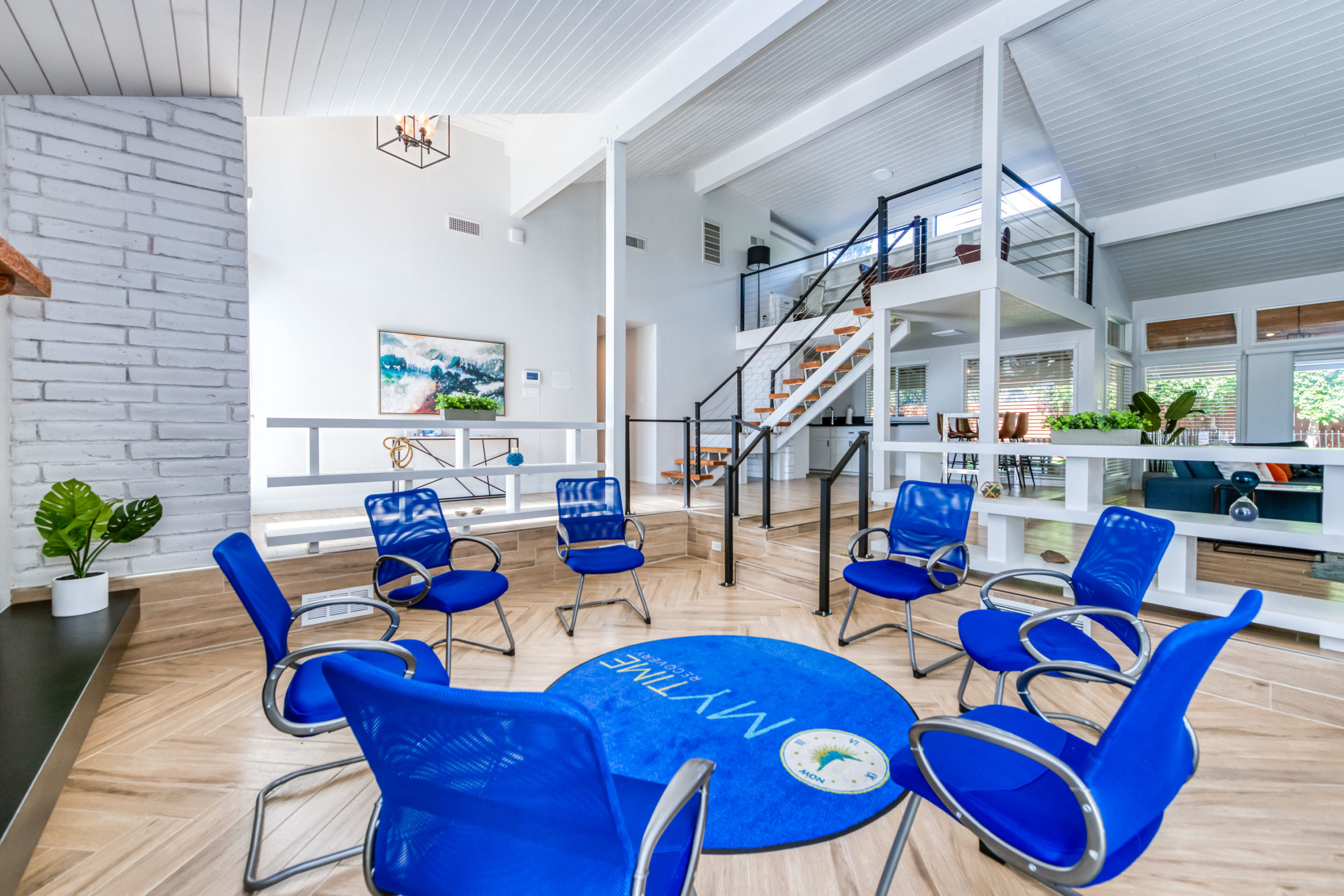 Circle of chairs in bright, modern therapy space